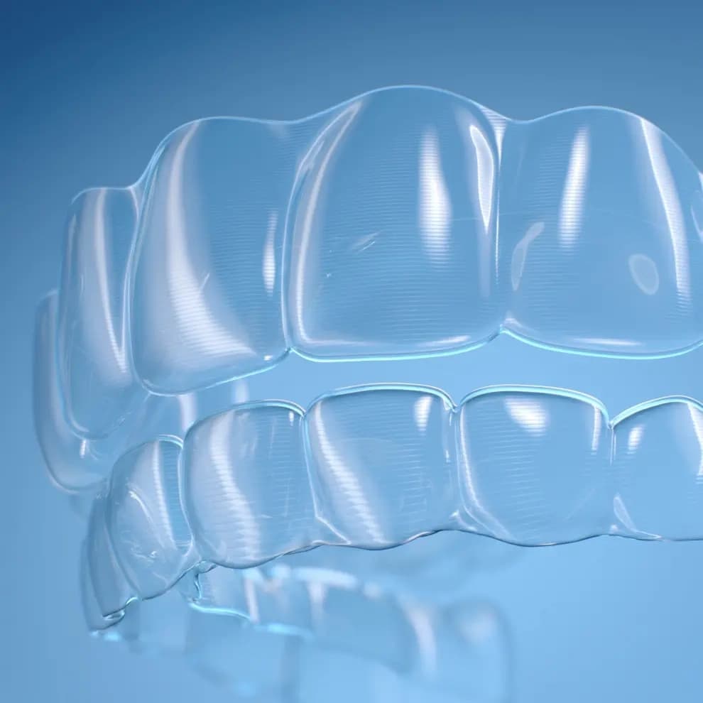 Sample of Invisalign® clear aligners on blue background